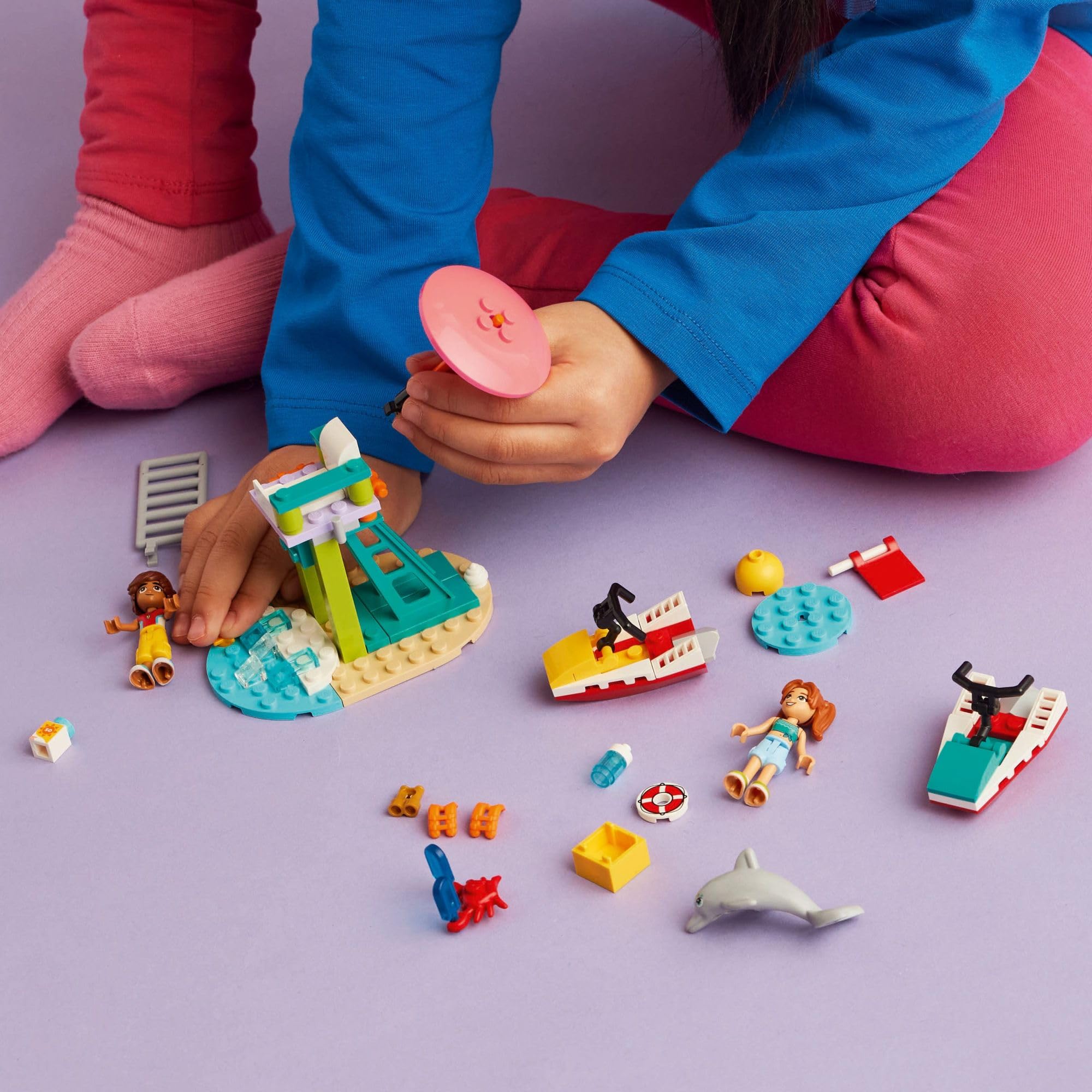 LEGO Friends Candi on a water scooter for beach racing play.