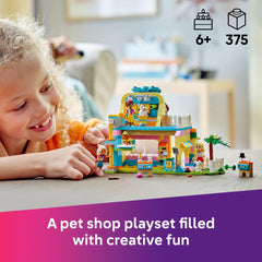 LEGO Friends dog-shaped building interior featuring grooming and shopping spaces