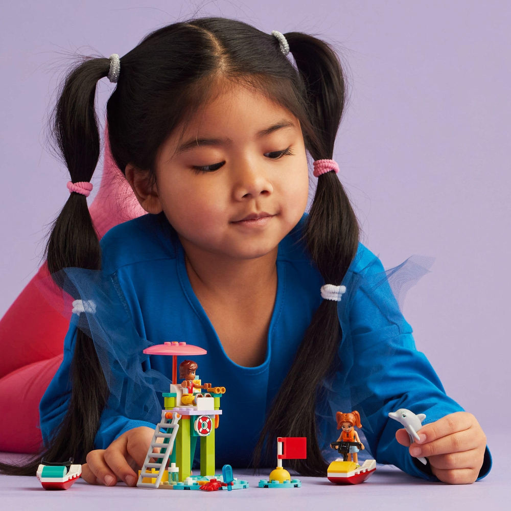 LEGO Friends Leo lifeguard with binoculars for ocean watching.