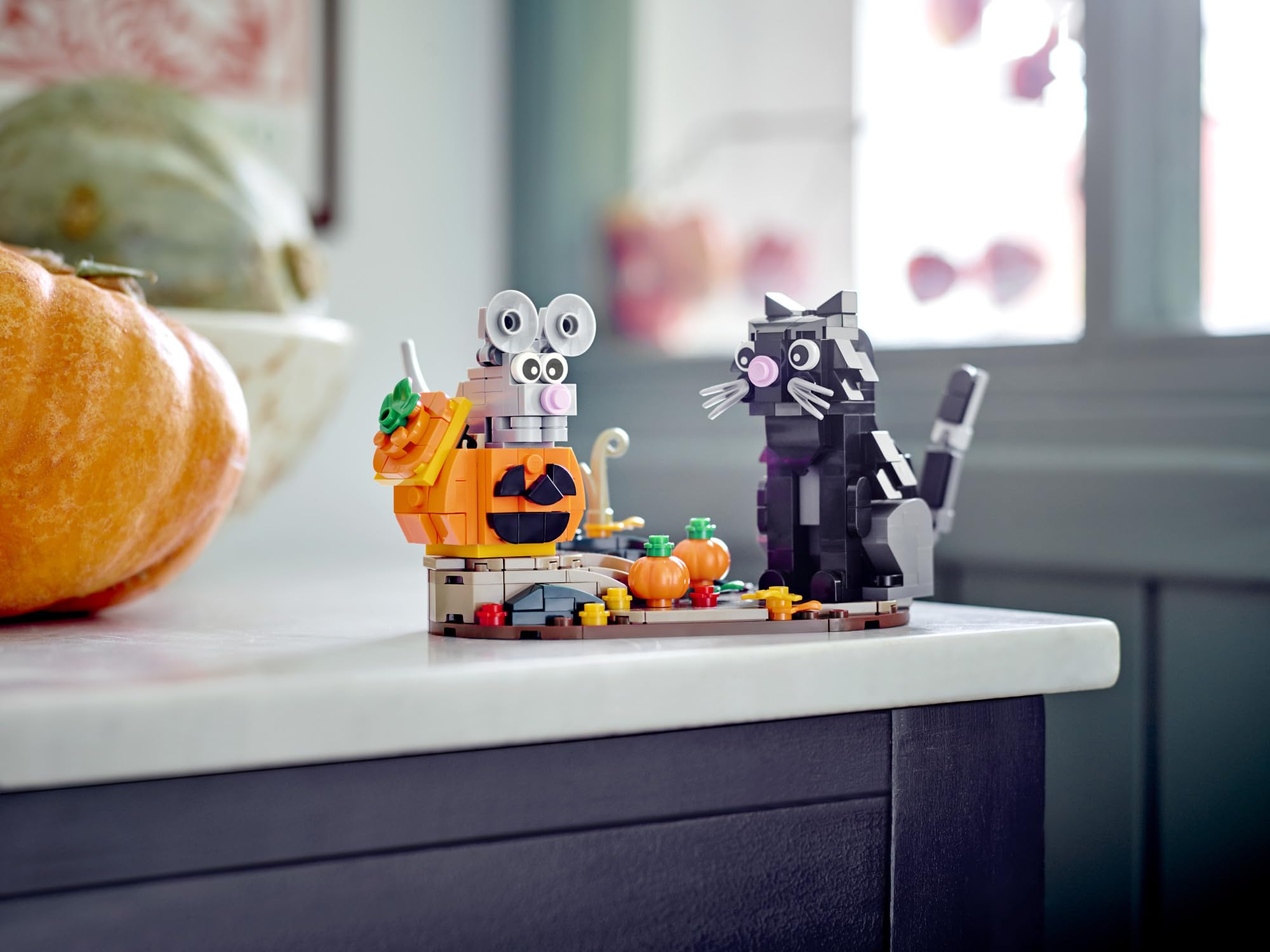 LEGO Halloween Cat & Mouse 40570 mouse detail peeking from a pumpkin adds cute charm to Halloween decor.