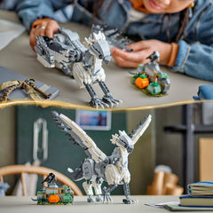 Two pumpkins and a bird accompany Buck in the display setup
