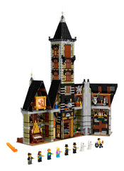 LEGO Icons Haunted House light bricks illuminate rooms with a moody glow