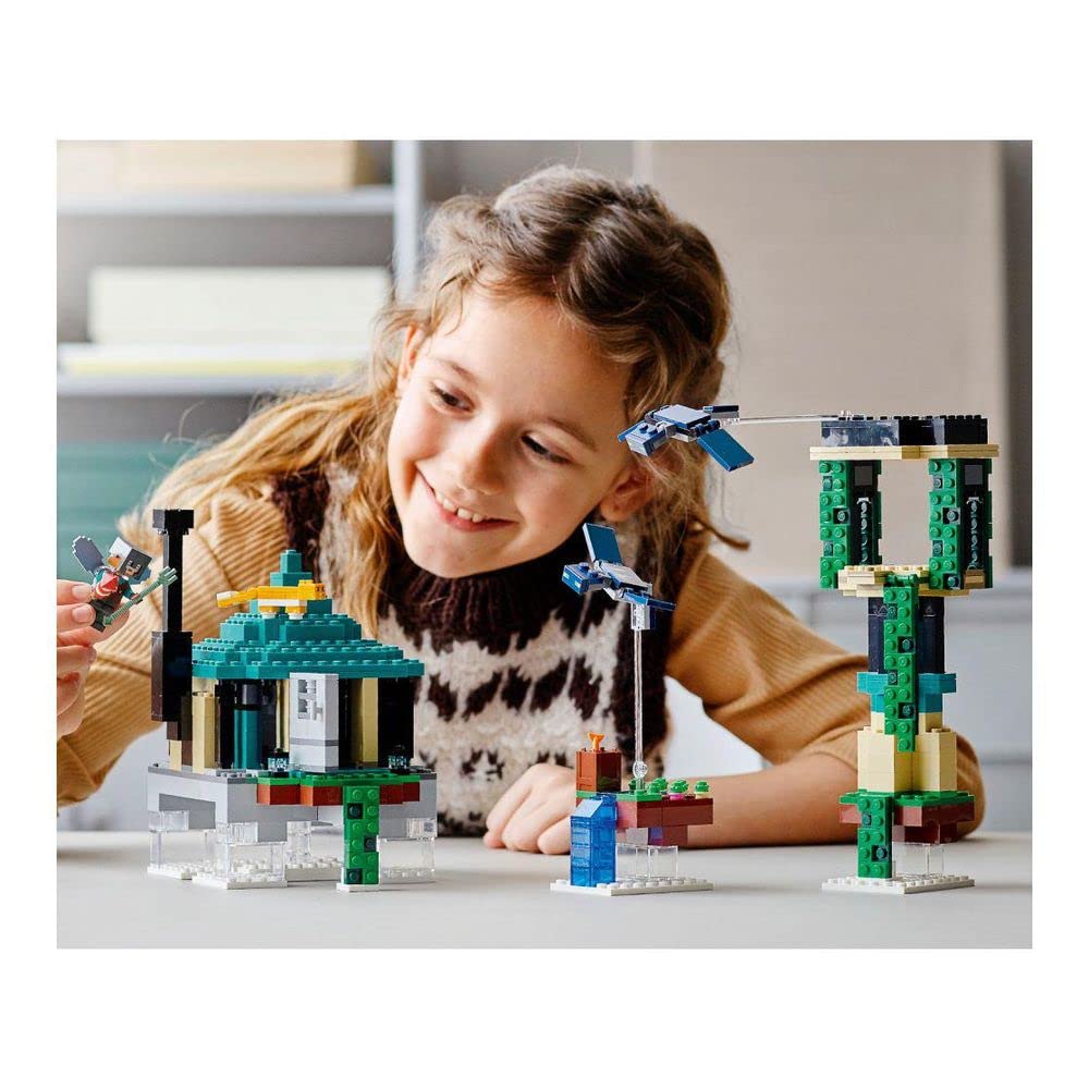 LEGO Minecraft Sky Tower orange tabby cat companion amid curious builds.