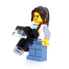 Lego minifigure nature photographer with camera accessory supports role-play adventures