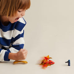 LEGO NINJAGO dragon tail slam action photo showing Kai and dragon in motion for kids.