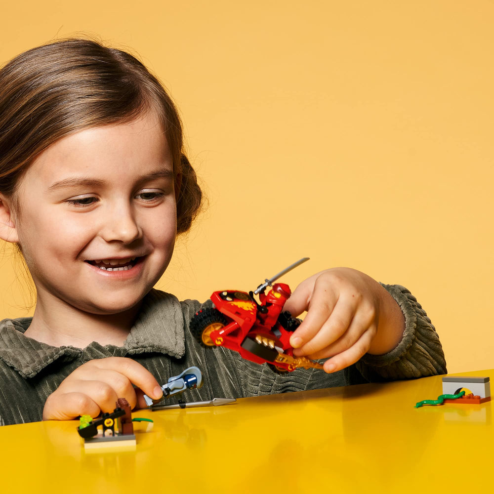 LEGO NINJAGO Kai blade cycle in motion shows dynamic ninja vehicle play.