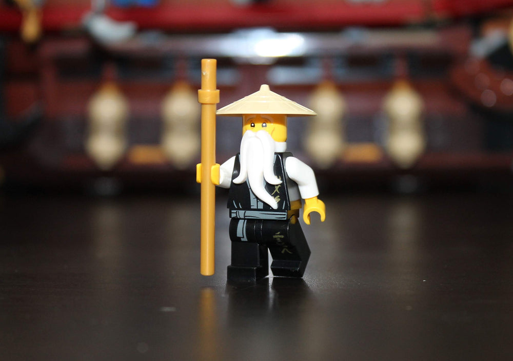 LEGO Sensei Wu figure wearing black robe for classic ninja aesthetics and posing.