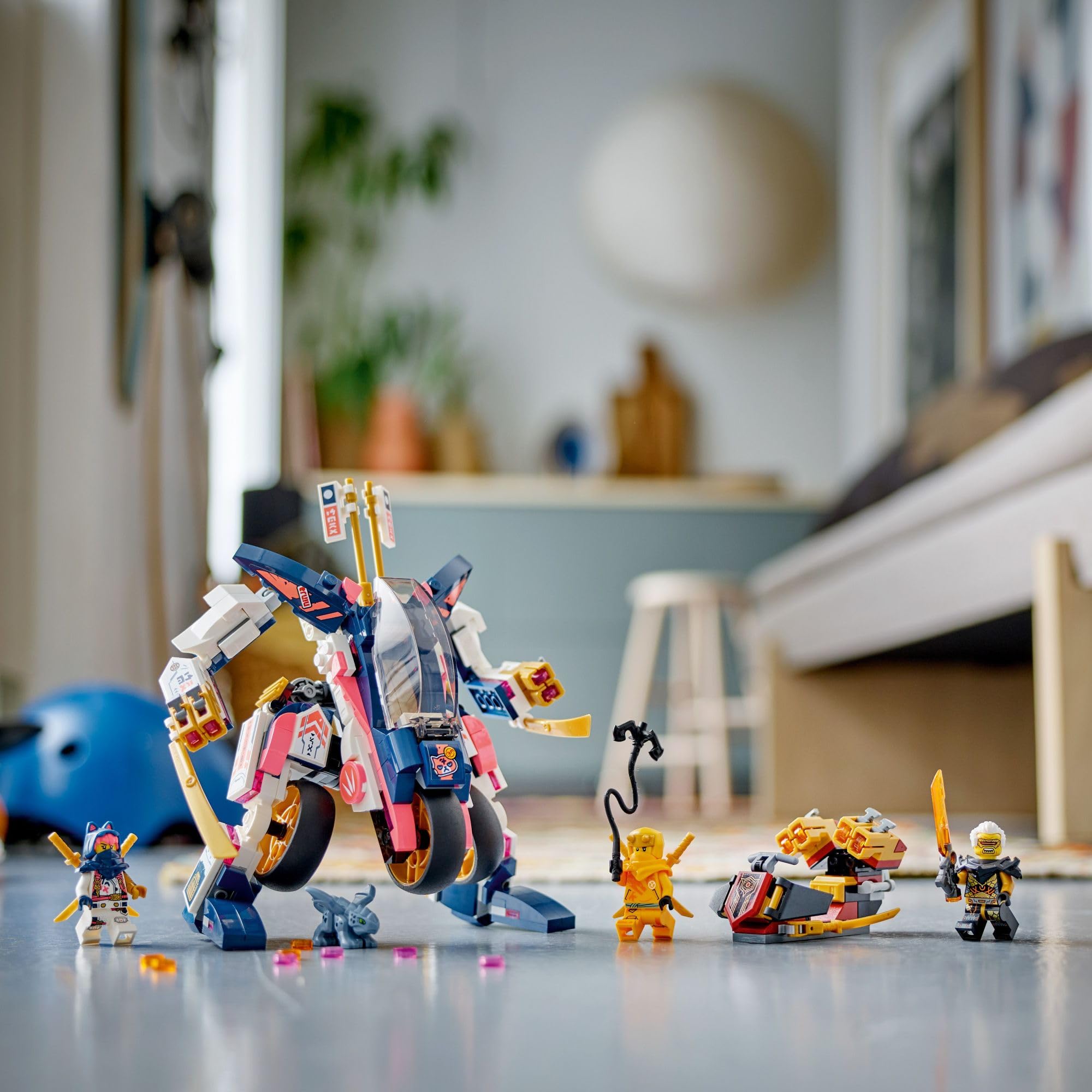 NINJAGO bike in action with three figures set up for combat