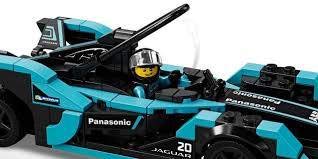Two minifigures in racing suits bring character and action to races.