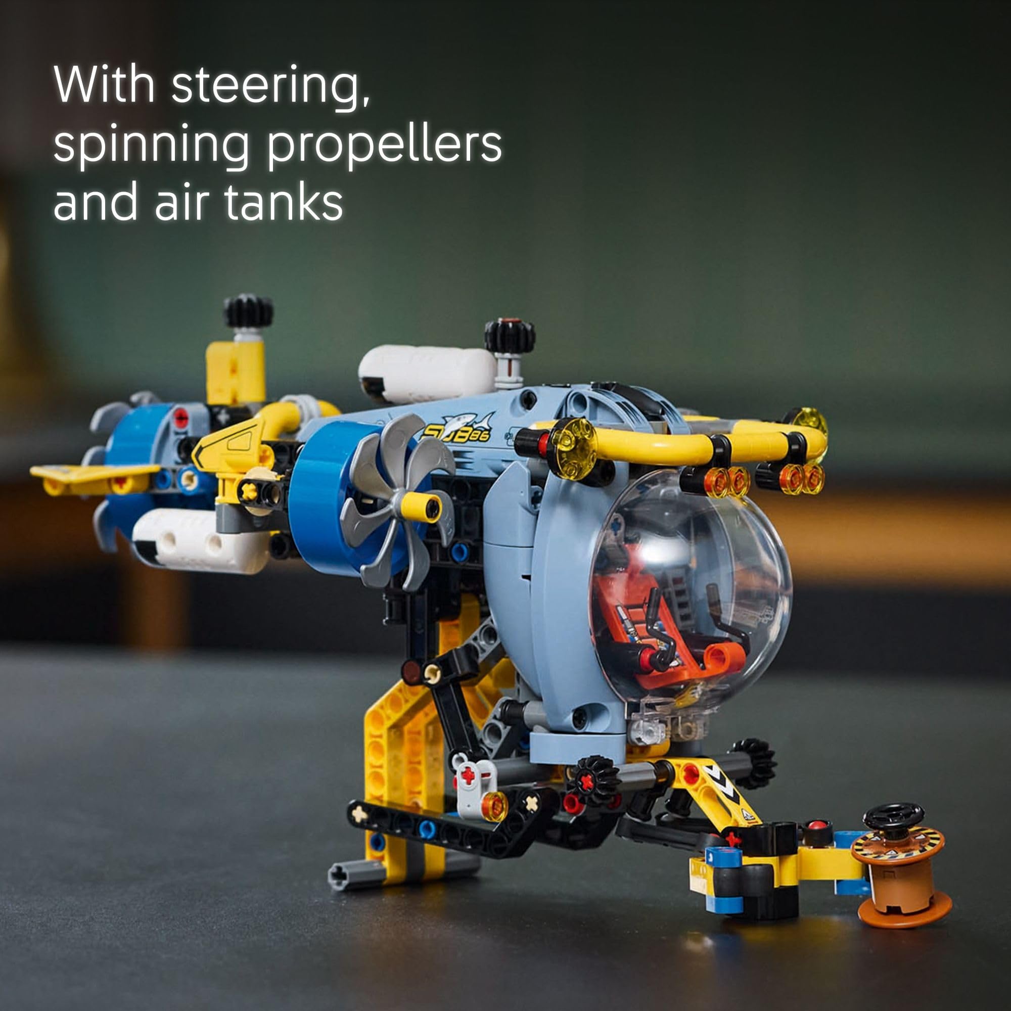 LEGO Technic Deep-Sea Submarine extending grabbing arm lifting a barrel.