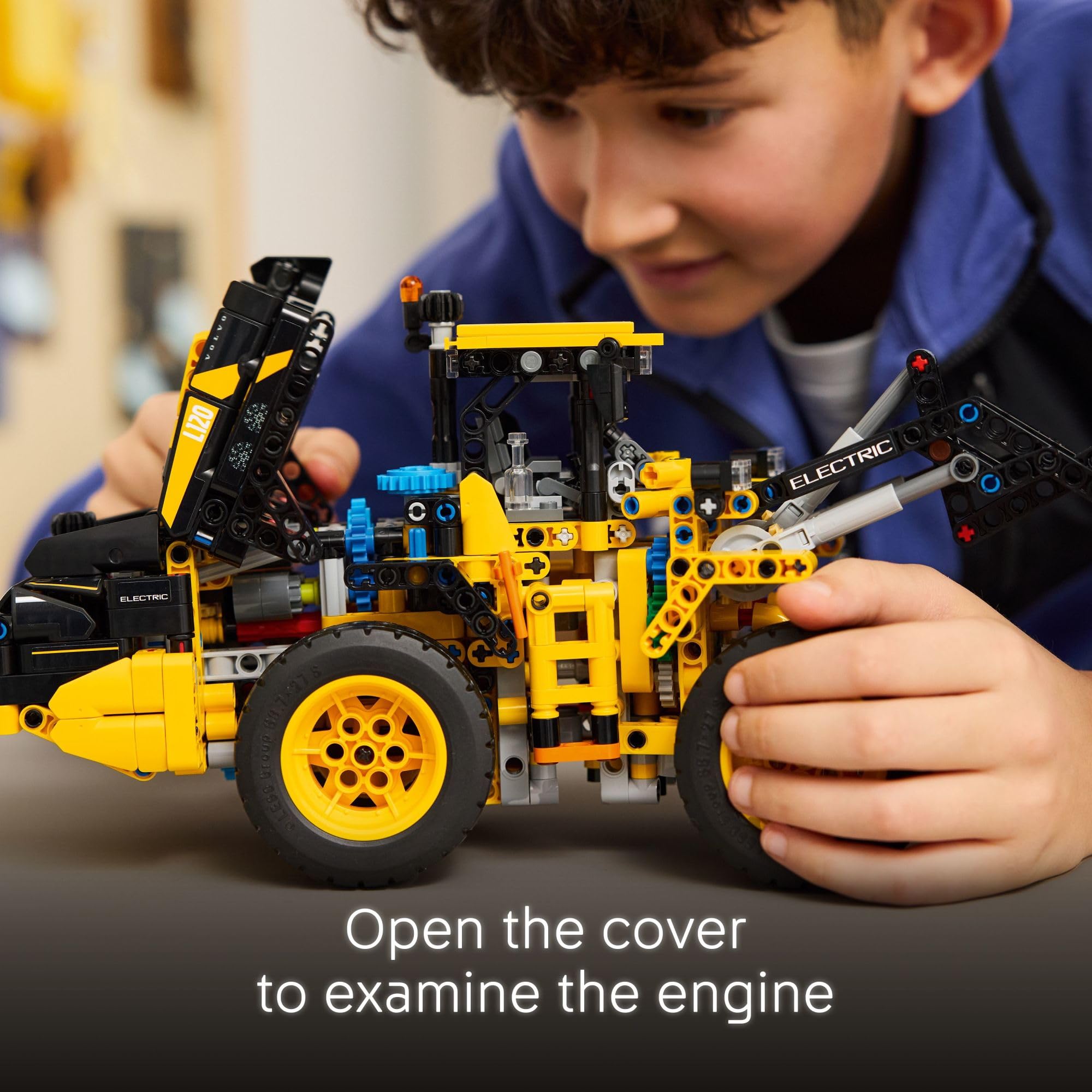 LEGO Technic Volvo L120 shovel action demonstrates adjustable height and tilt for lifelike loading