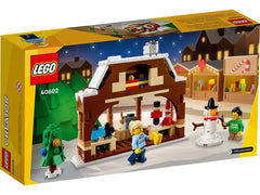 LEGO Winter Market Stall minifigures in Christmas sweaters invite playful scenes.