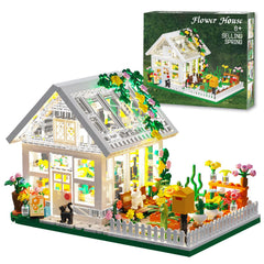 LEGPS YYDS Flower House with LED lights creating a warm night display on a shelf