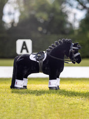 LeMieux Toy Pony Saddle features detachable girth and metal stirrups for practice.