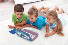Child using Lexibook Stitch laptop during travel ideal for car journeys