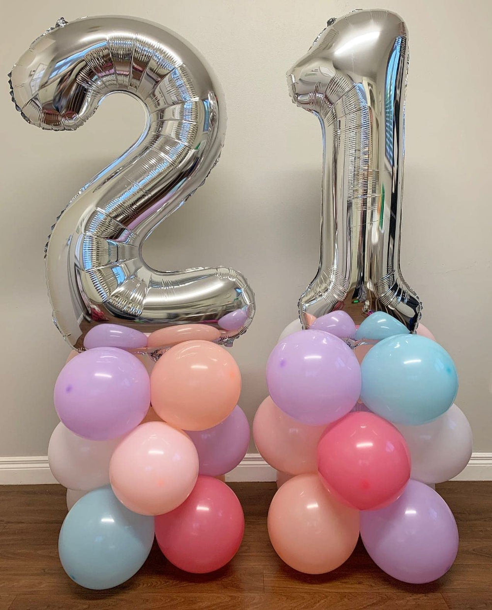 LHOAVWE silver number balloon on wall creates stylish decor.