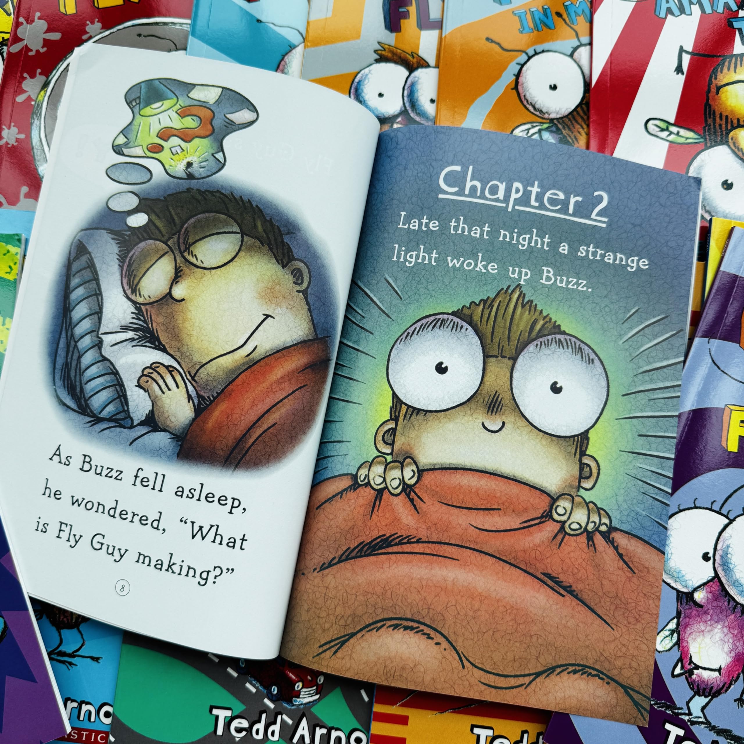 Children reading Limonuos Fly Guy books, boosting imagination and reading confidence.
