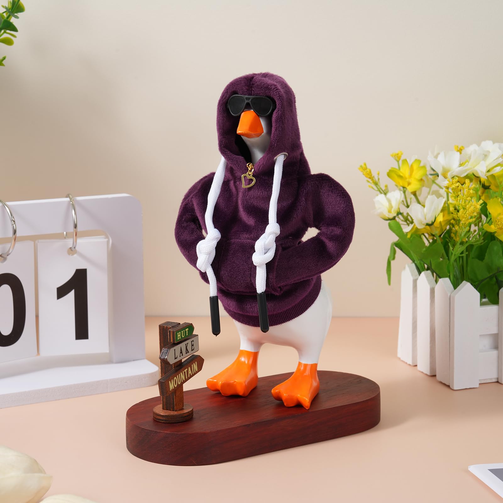 Linastu creative decor idea featuring purple outfit on desk goose