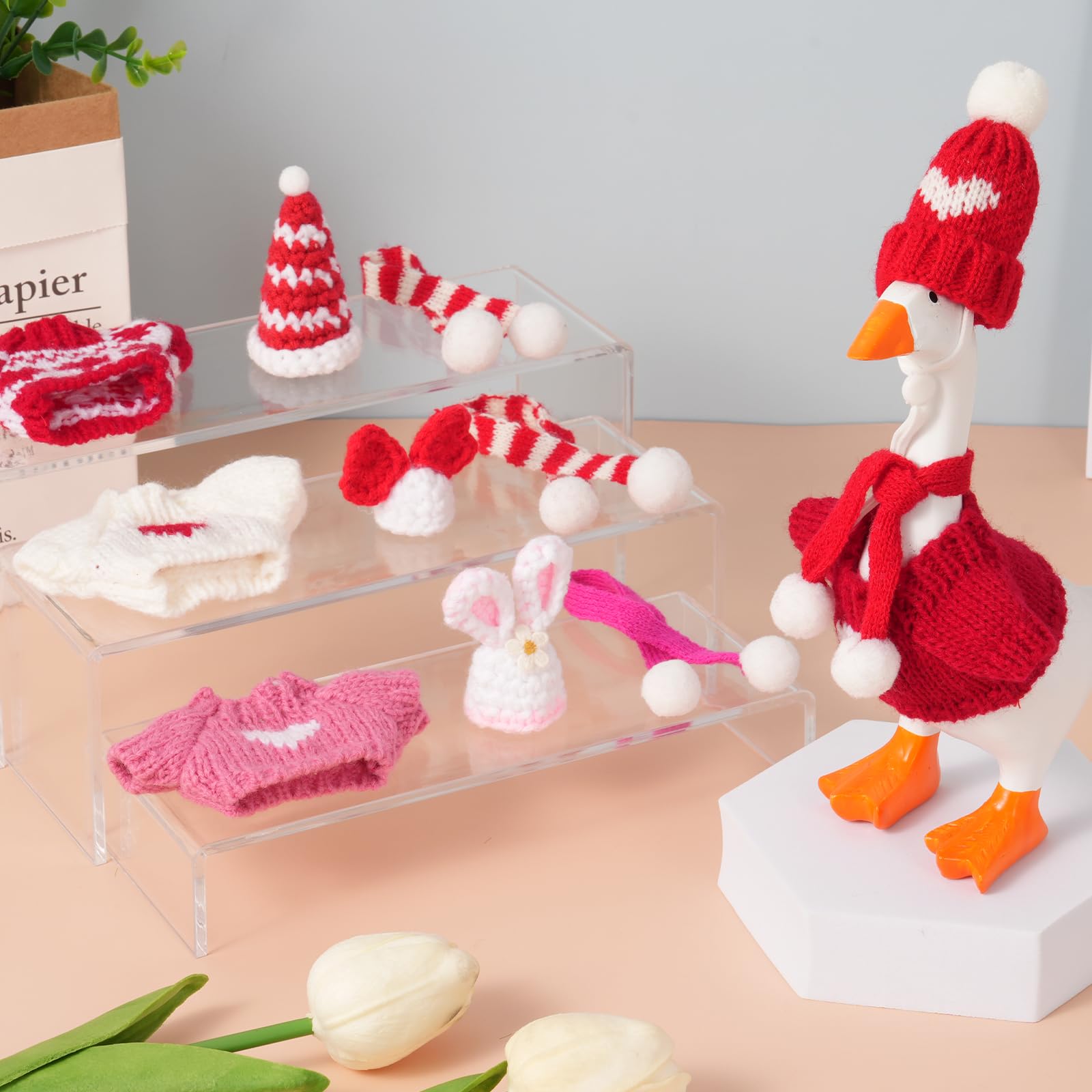 Linastu desk goose on a tidy desk setup in festive outfits.