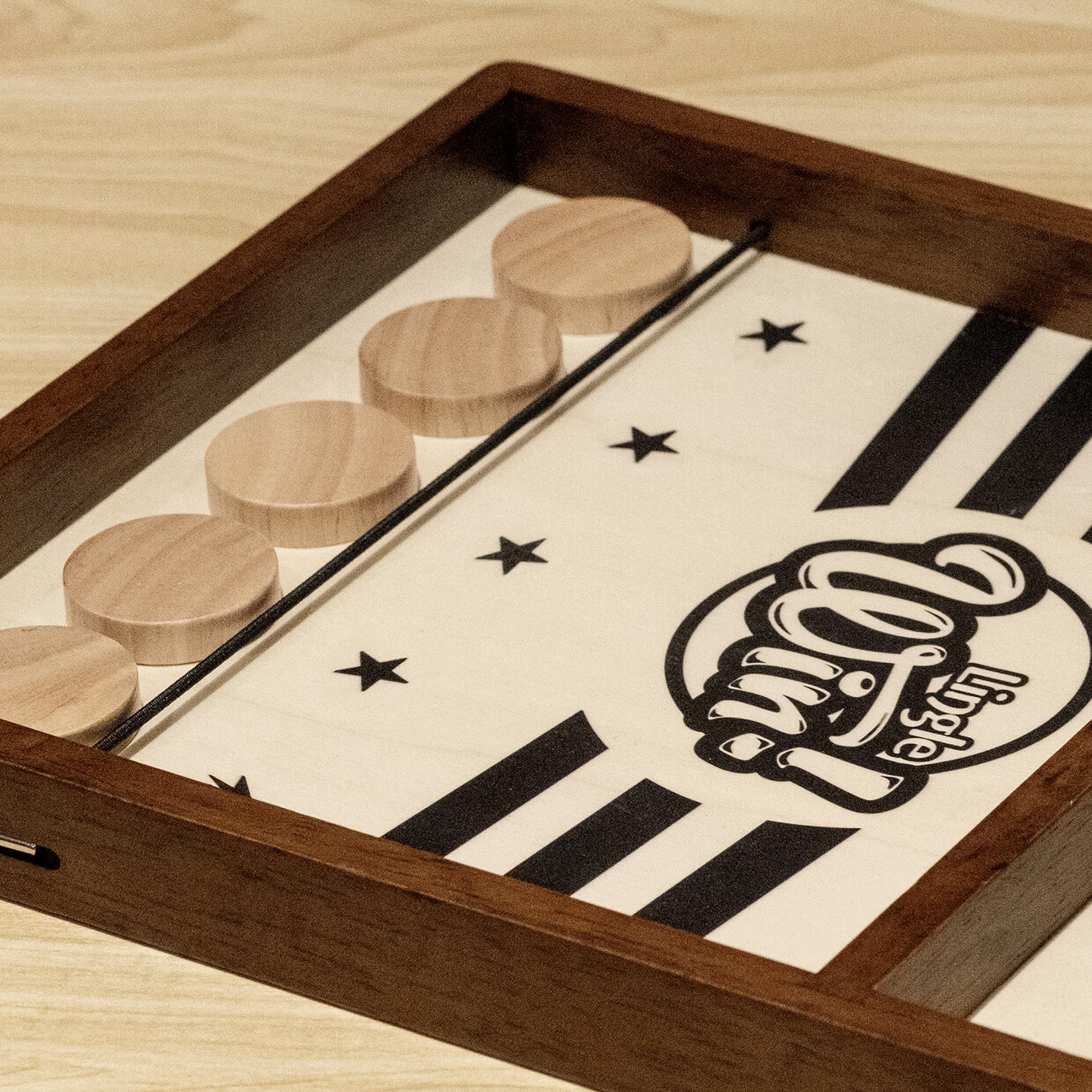 Lingle Sling Puck Game pucks ensure smooth play and quick scoring.