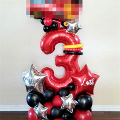 Lingqiang Red Number 1 balloon on a table with cake for celebrations.