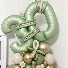 Lingqiang sage green balloon with straw deflation accessory for reuse.