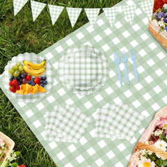 LINHAXM sage green gingham tablecloth 54-by-108 inches protects surfaces.