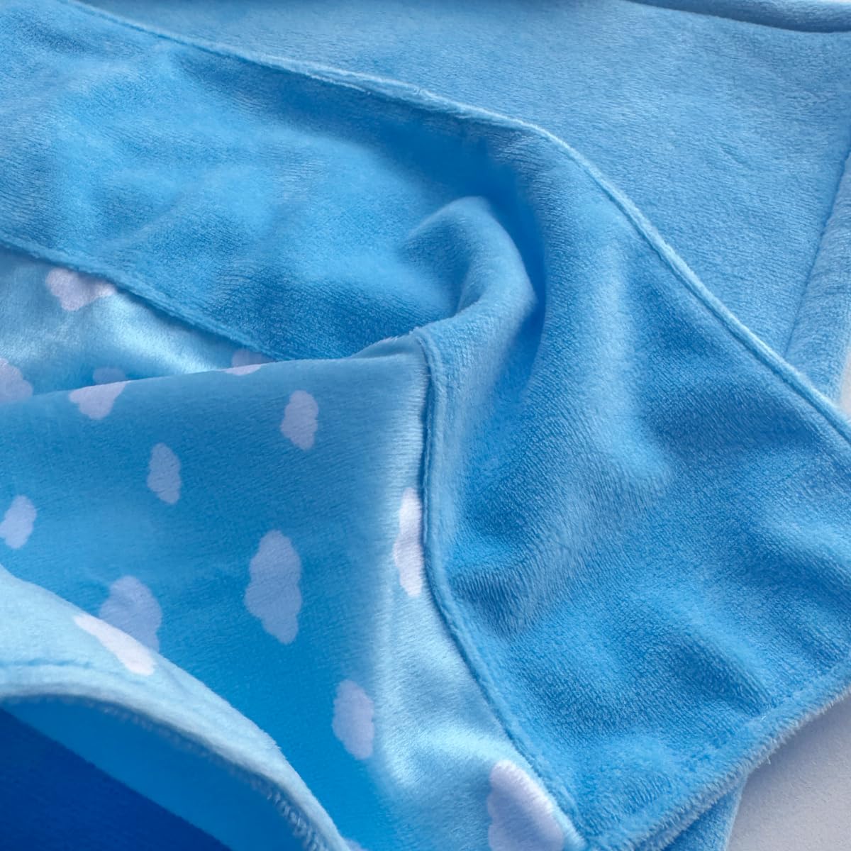 Linkyloop foldable blanket for doll beds travels easily.