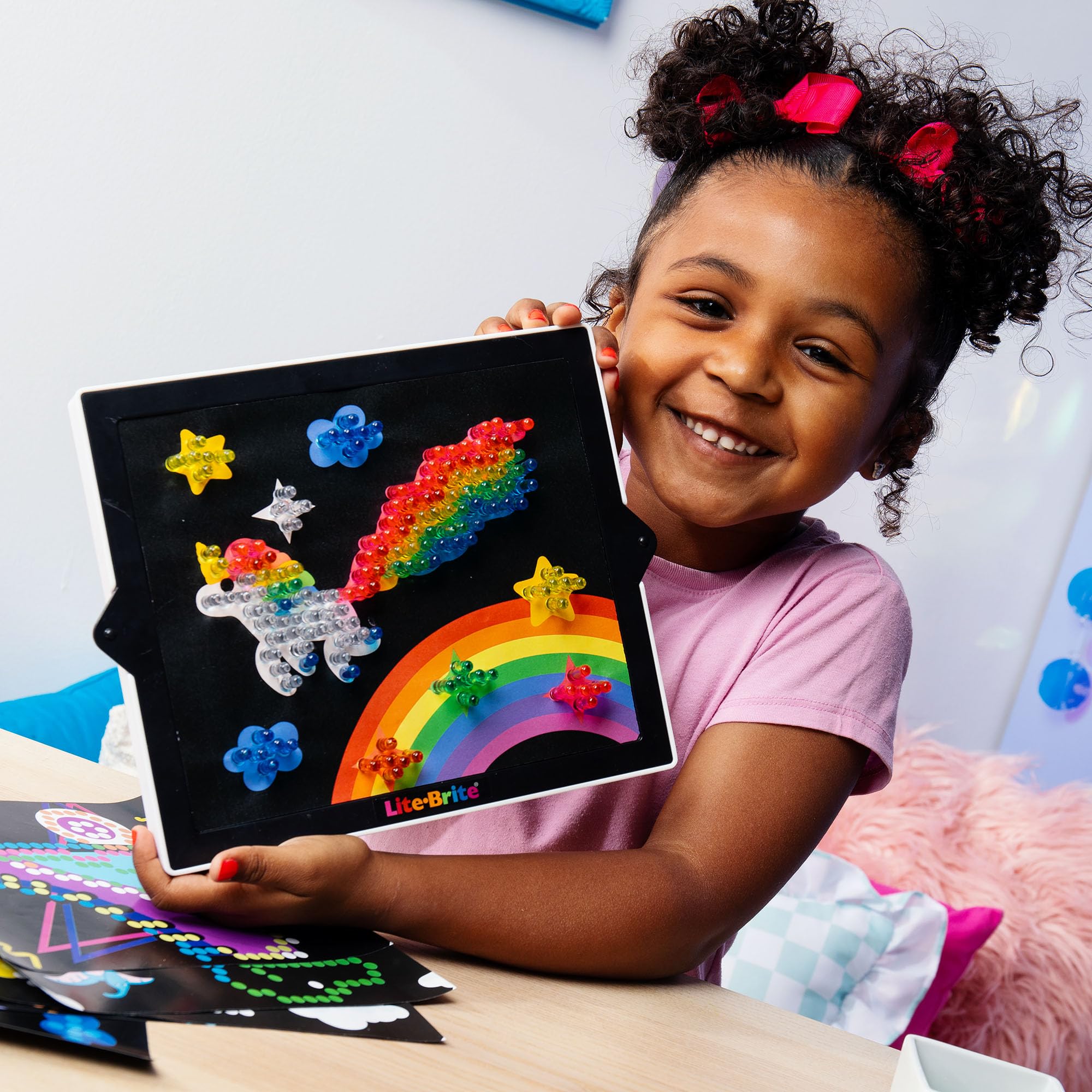 Lite-Brite Classic artwork on the board inspires car rides and quiet afternoons.