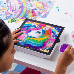 Lite-Brite ColorPOP Rainbow Dreams Twinkle Palace glows beside a sparkling castle