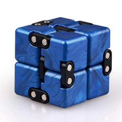 Little Golden Elephant infinity cube palm-top view for stress relief and focus.