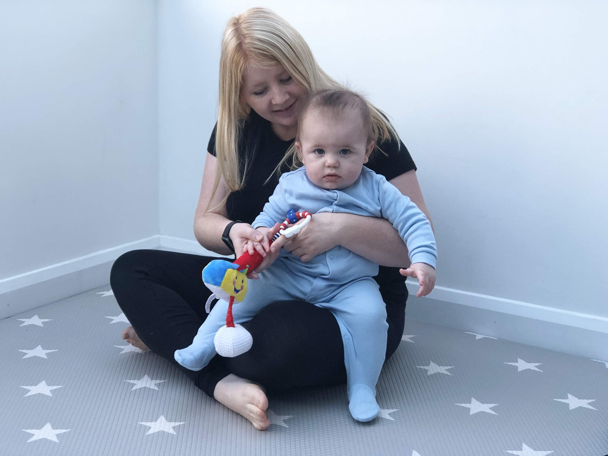 Little Sport Star golf club fitting into a baby hand for early exploration.