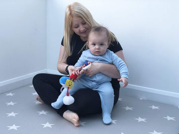 Little Sport Star golf club fitting into a baby hand for early exploration.