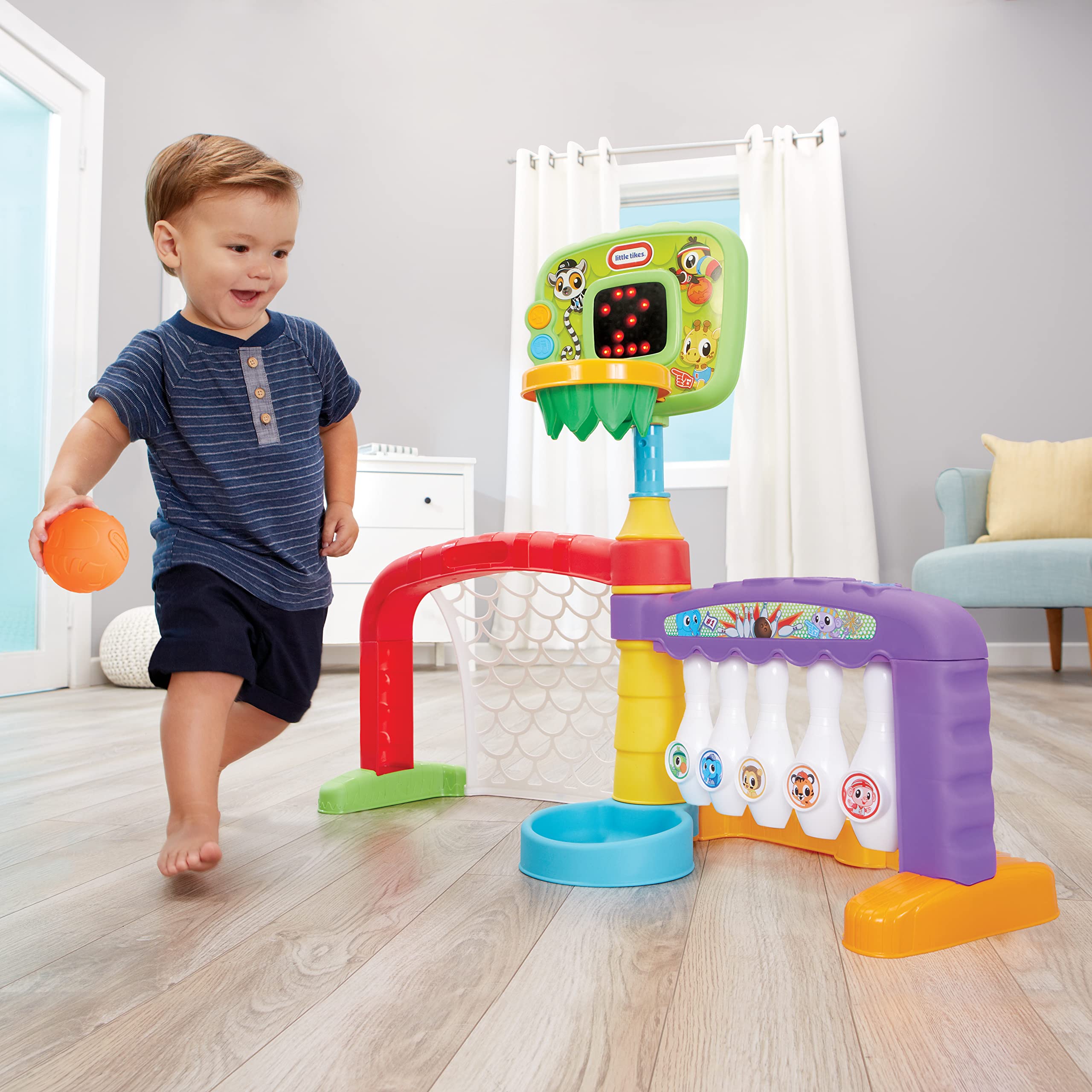 Little Tikes 3-in-1 Sports Zone backboard lights signal made shots, adding excitement.