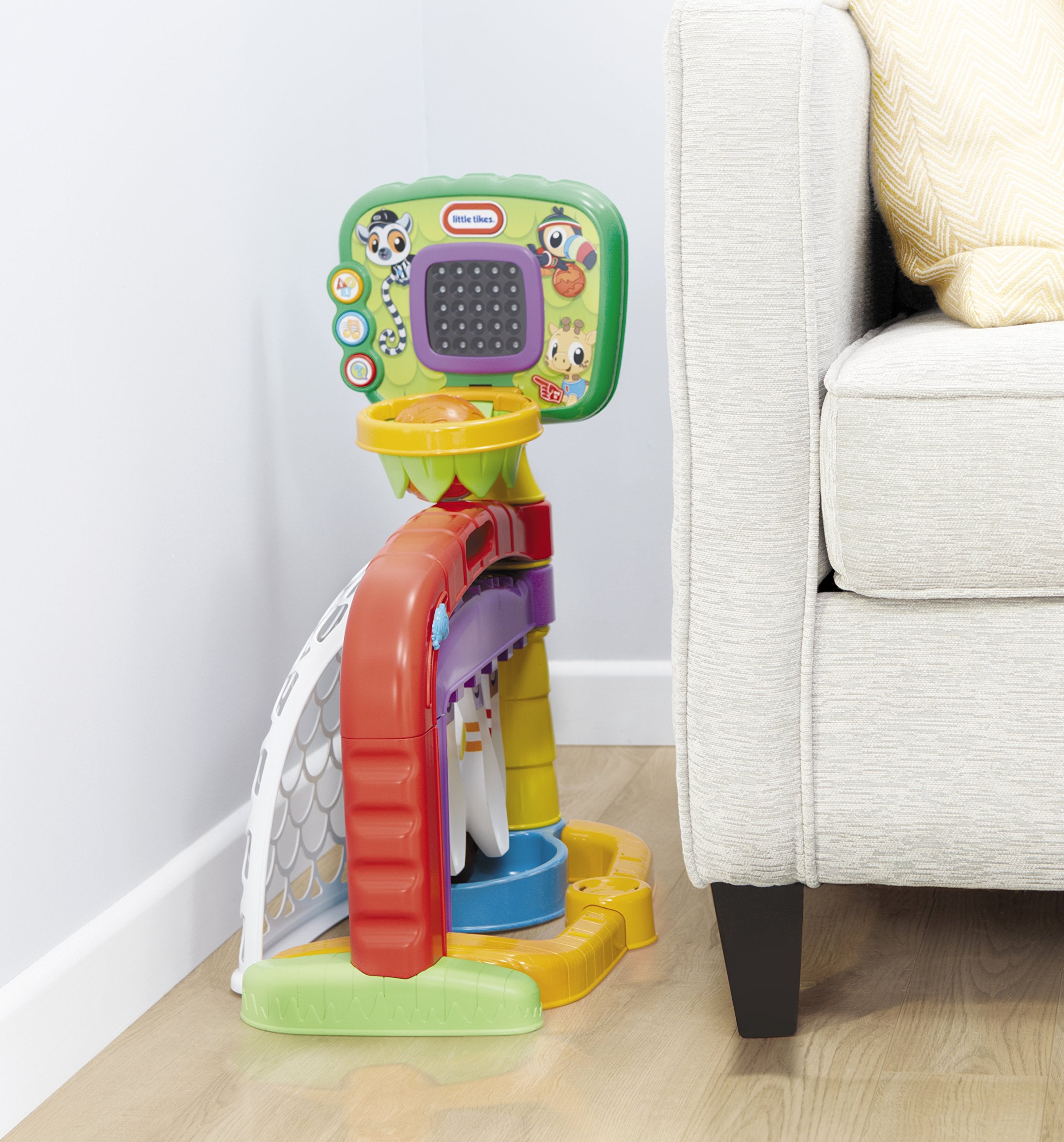 Little Tikes 3-in-1 Sports Zone includes balls for immediate play and practice.