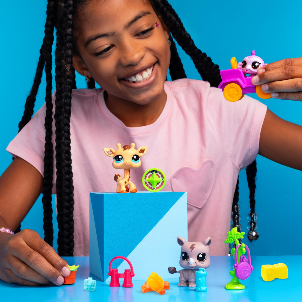 Giraffe safari adventure figure enhances colorful pet collection.