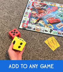 LMC Products jumbo dice held in hand for easy tossing.
