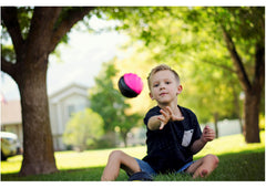 LMC Products mini football in hand, soft grip for easy catching.