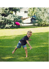 LMC Products mini football on grass, ideal for backyard play.