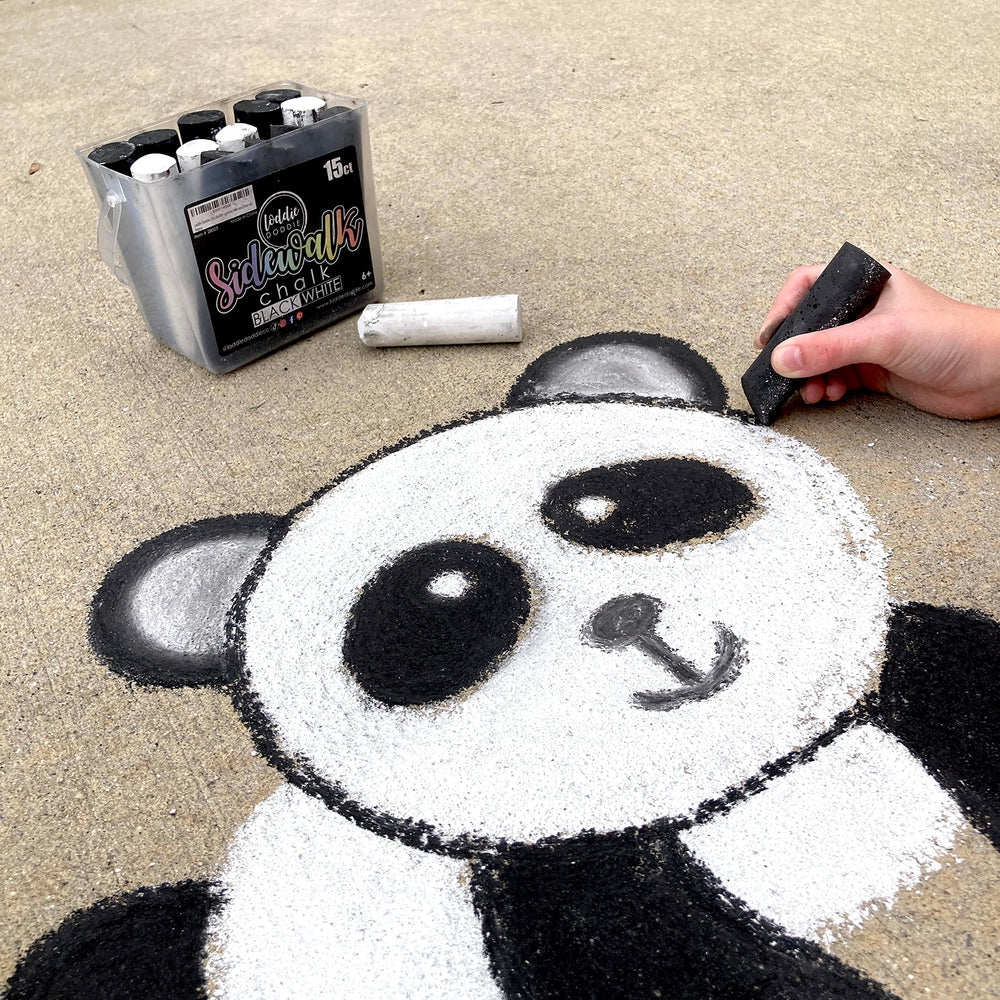 Bright white chalk creates high-contrast sidewalk art on driveways