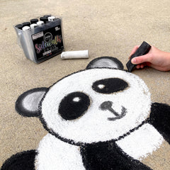 Bright white chalk creates high-contrast sidewalk art on driveways