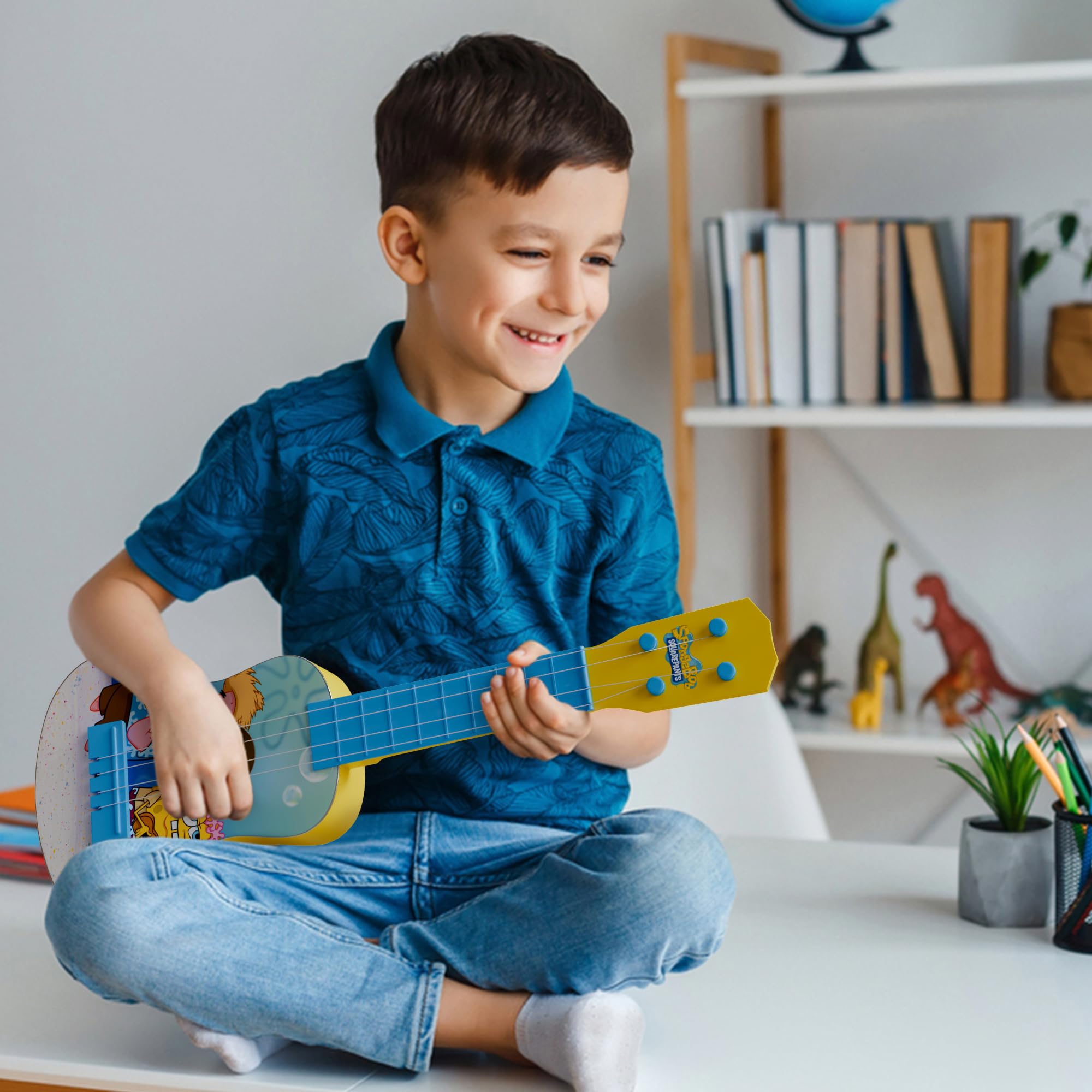 Lollipop mini guitar for early rhythm and melody exploration.