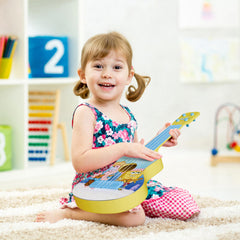 Lollipop ukulele with strap-ready design for portable playtime.
