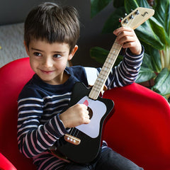 Loog Mini low action helps smoother fret movement.
