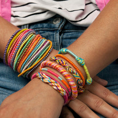 Loopdedoo used by a child to craft personalized bracelets.