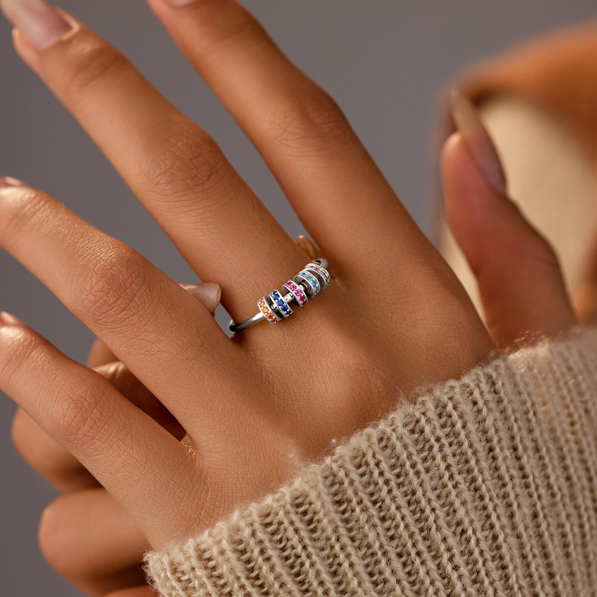 LOVECOM S925 silver fidget ring close-up of cubic zirconia beads.