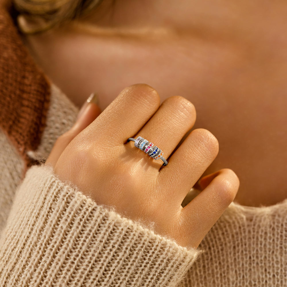 LOVECOM S925 silver fidget ring worn on finger for discreet calm.