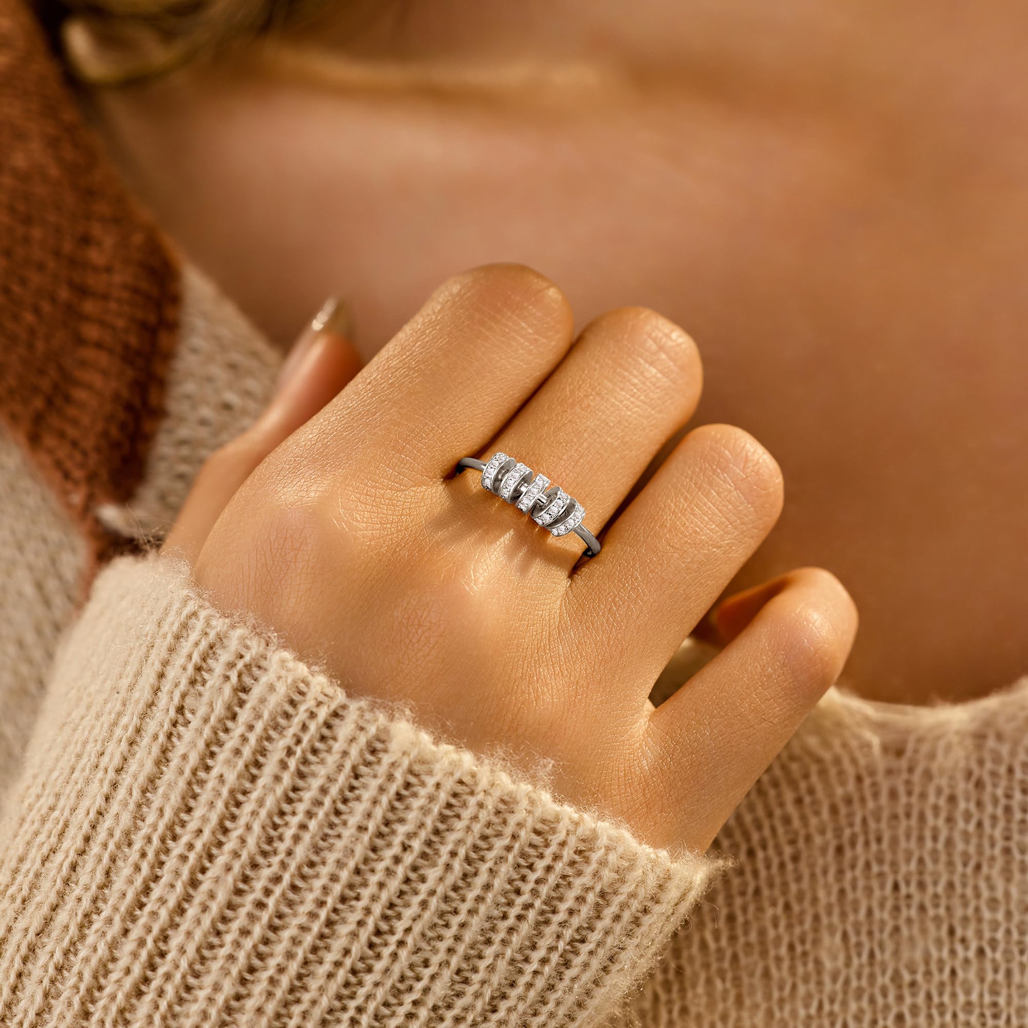 Unisex LOVECOM ring designed for stacking and everyday wear