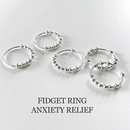 LOVECOM sterling silver beads ring rotation close-up for tactile focus.