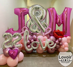 Lovoir X balloon hung from top holes for bold display.